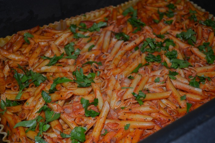 You can see the lasagna noodles lining the edge of the pan. This keeps the pasta from drying out as it cooks!